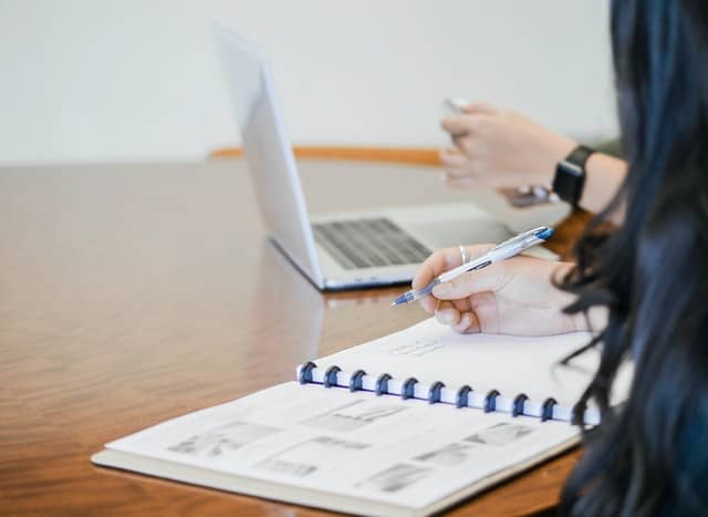 A picture of a woman taking notes